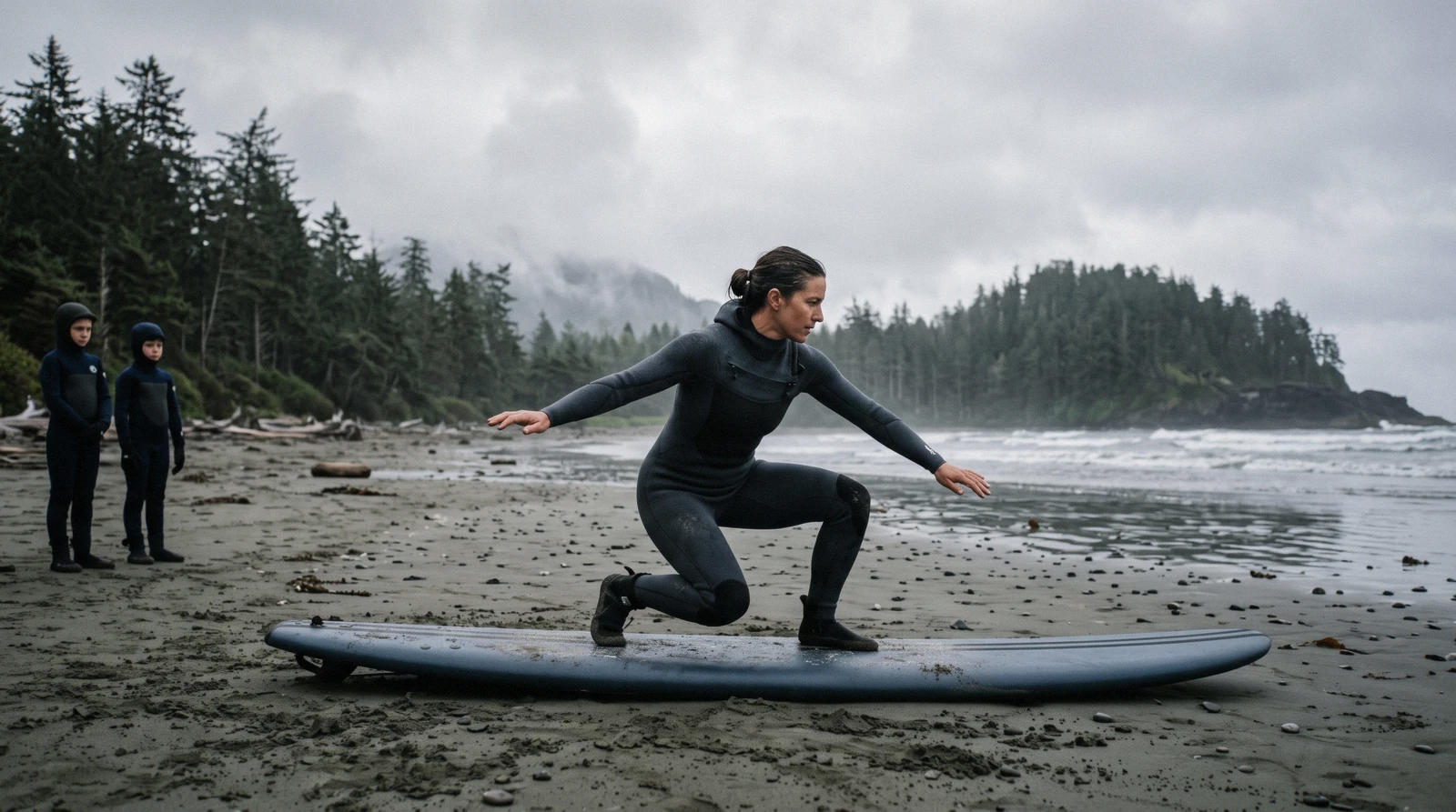 Instructor teaching surf lessons to a small group in the shallows at a Tofino beach