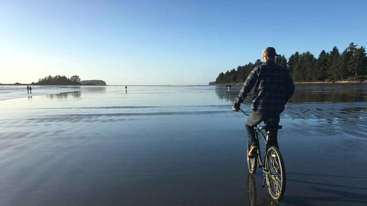 Beach cruiser bikes parked near the trailhead on a Tofino bike and hike tour